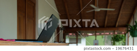 Lobby entrance of a cute hostel with laptop at 19676431