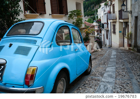 Small italian car on narrow road in village Scilla 19676783