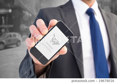 Composite image of businessman showing his smartphone screen 19678016
