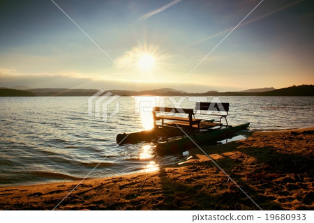 Abandoned old rusty pedal boat stuck on coastline 19680933
