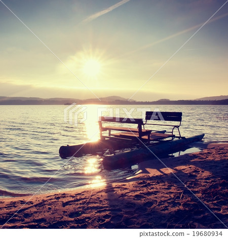 Abandoned old pedal boat stuck on sand of beach. Abandoned old pedal boat stuck on sand of beach. 19680934