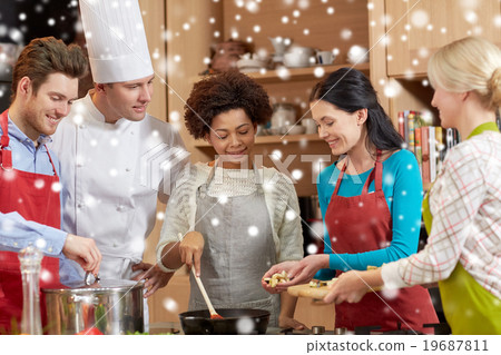 happy friends and chef cook cooking in kitchen happy friends and chef cook cooking in kitchen 19687811