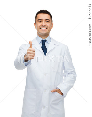 smiling doctor in white coat showing thumbs up smiling doctor in white coat showing thumbs up 19687813