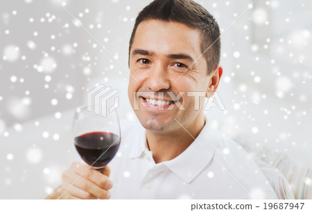 happy man drinking red wine from glass at home happy man drinking red wine from glass at home 19687947