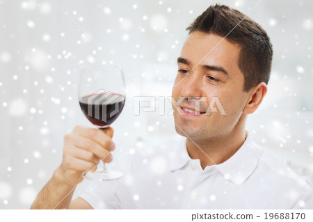 happy man drinking red wine from glass 19688170