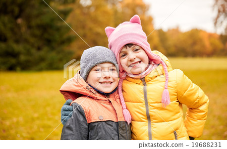happy little girl and boy in autumn park happy little girl and boy in autumn park 19688231