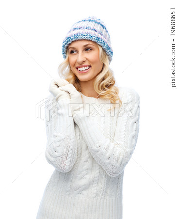 smiling young woman in winter hat and sweater smiling young woman in winter hat and sweater 19688651