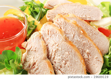 Sliced chicken breast with salad and sweet chilli sauce Sliced chicken breast with salad and sweet chilli sauce 19689119
