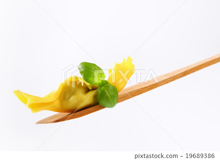 Stuffed pasta on wooden spatula 19689386