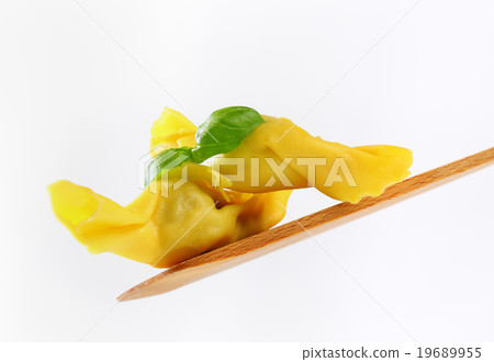 Stuffed pasta on wooden spatula Stuffed pasta on wooden spatula 19689955