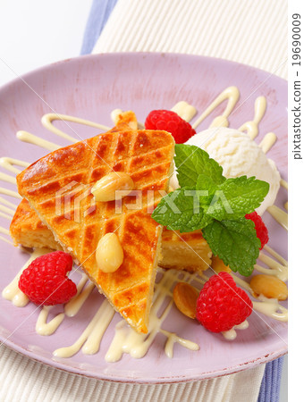 Almond cake with ice cream and raspberries 19690009