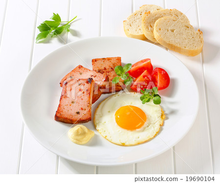 Pan-fried Leberkase with sunny side up fried egg 19690104