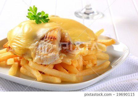Cheese topped fish fillets with French fries Cheese topped fish fillets with French fries 19690115