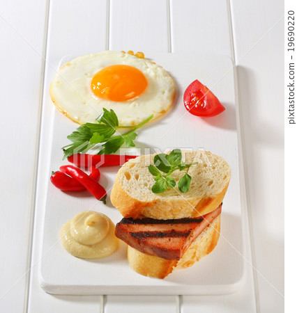 Grilled Leberkase sandwich with mustard and fried egg 19690220