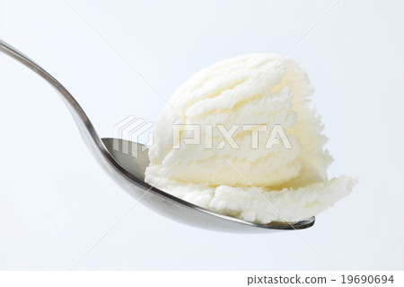 Frozen yogurt on spoon Frozen yogurt on spoon 19690694