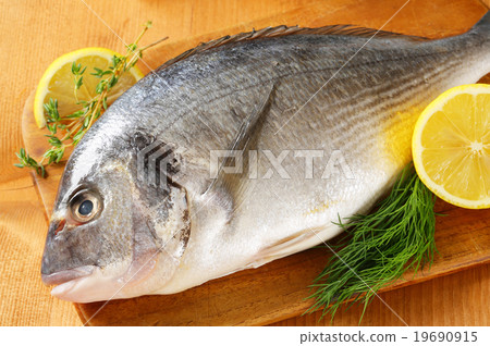 Fresh sea bream on cutting board Fresh sea bream on cutting board 19690915