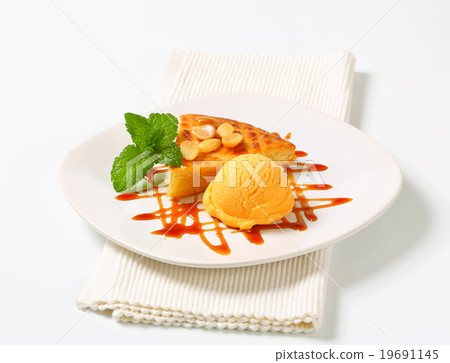 Almond cake with ice cream and caramel sauce 19691145