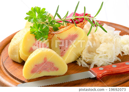 Meat stuffed potato dumplings with shredded cabbage Meat stuffed potato dumplings with shredded cabbage 19692073