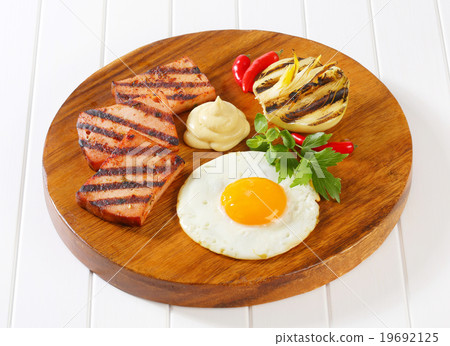 Grilled Leberkase with fried egg and mustard Grilled Leberkase with fried egg and mustard 19692125