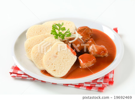 Pork meat in tomato sauce with dumplings Pork meat in tomato sauce with dumplings 19692469