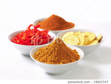 Curry powder, ground cinnamon, sliced ginger root and red pepper 19692547