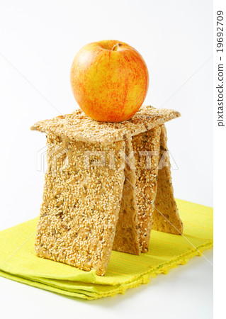 Sesame seed crackers and fresh apple Sesame seed crackers and fresh apple 19692709