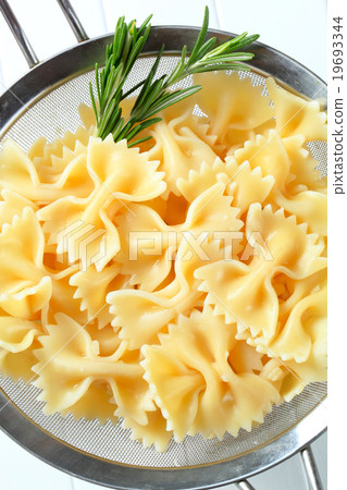 Bow tie pasta in a sieve Bow tie pasta in a sieve 19693344