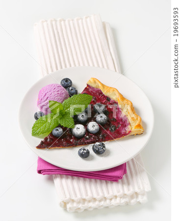 Slice of blueberry tart with ice cream Slice of blueberry tart with ice cream 19693593
