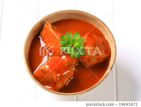 Pork meat in tomato sauce 19693871