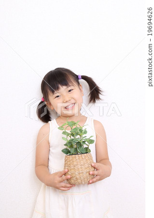 A girl with a garden tree 19694626