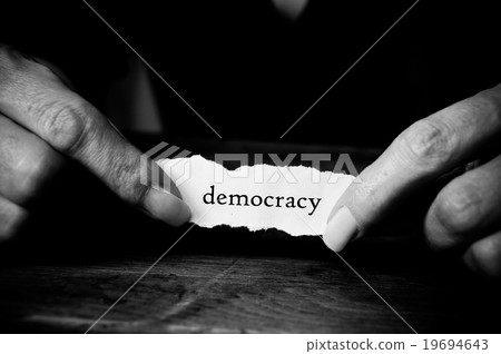 Concept woman with message on paper  - democracy 19694643