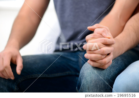 Loving homosexuals sitting on the sofa Loving homosexuals sitting on the sofa 19695516
