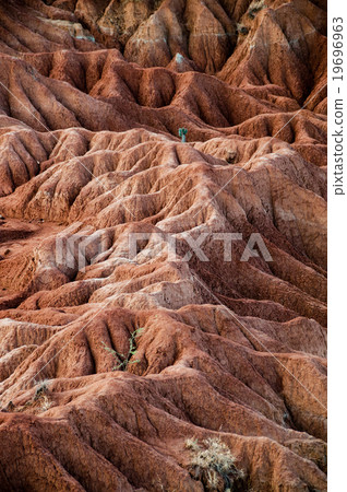 Big red sandstone rock formation in hot dry desert Big red sandstone rock formation in hot dry desert 19696963