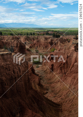 Steep cliff and valley of red orange sand stone Steep cliff and valley of red orange sand stone 19697024