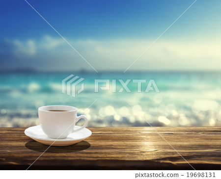 sea and cup of coffee 19698131