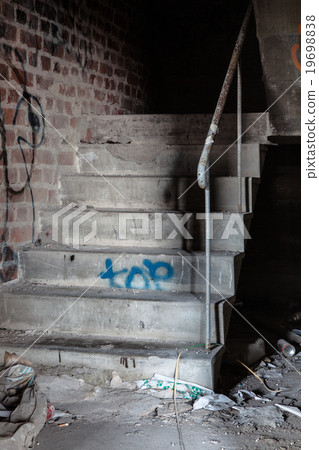 Creepy staircase in abandoned warehouse 19698838