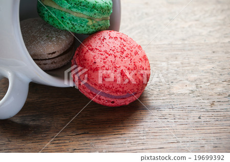 assortment of french macarons on wooden background assortment of french macarons on wooden background 19699392
