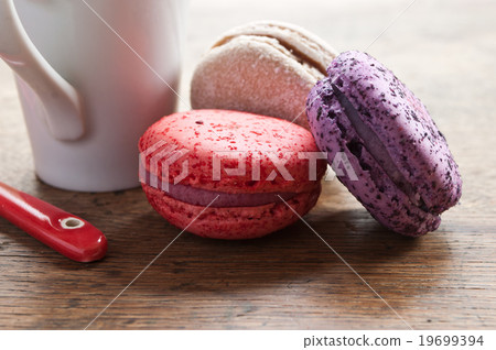 assortment of french macarons and cup of coffee  19699394