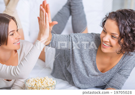 Sisters are cheering and high fiving. Sisters are cheering and high fiving. 19705028