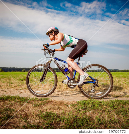 Women on bike 19709772