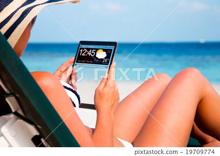 Woman with a tablet in hands 19709774