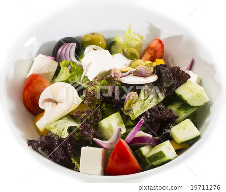 Greek salad on a white background in the restauran Greek salad on a white background in the restauran 19711276