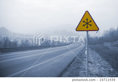 snowy road with frozen sign in winter snowy road with frozen sign in winter 19711439