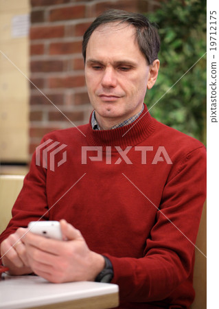 Mature man with smartphone 19712175