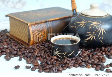 Cup of coffee, coffee beans, a teapot 19712476