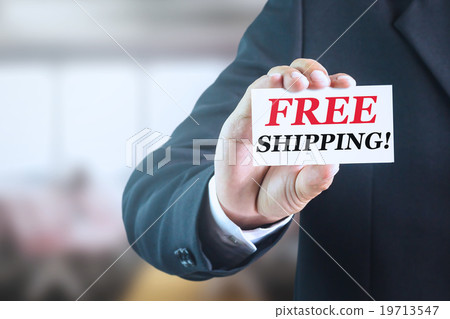 Businessman holding white label text Free shipping 19713547