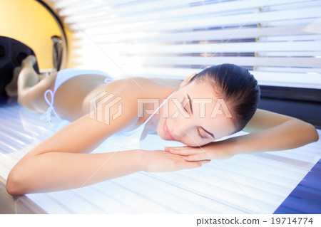 Attractive woman is getting sunbathing beauty Attractive woman is getting sunbathing beauty 19714774
