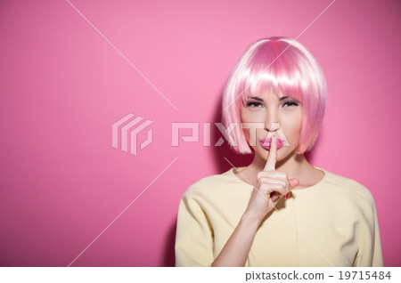 Beautiful young girl is asking for silence 19715484