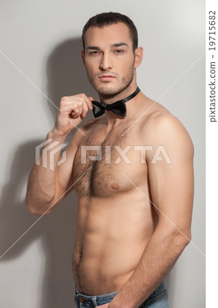 Attractive fit guy is showing his bared body 19715682