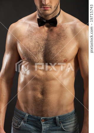 Cheerful young man with perfect figure Cheerful young man with perfect figure 19715743